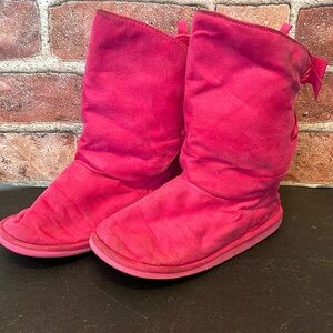 Girls pink moccasin boots that tie up in back. Size 12.